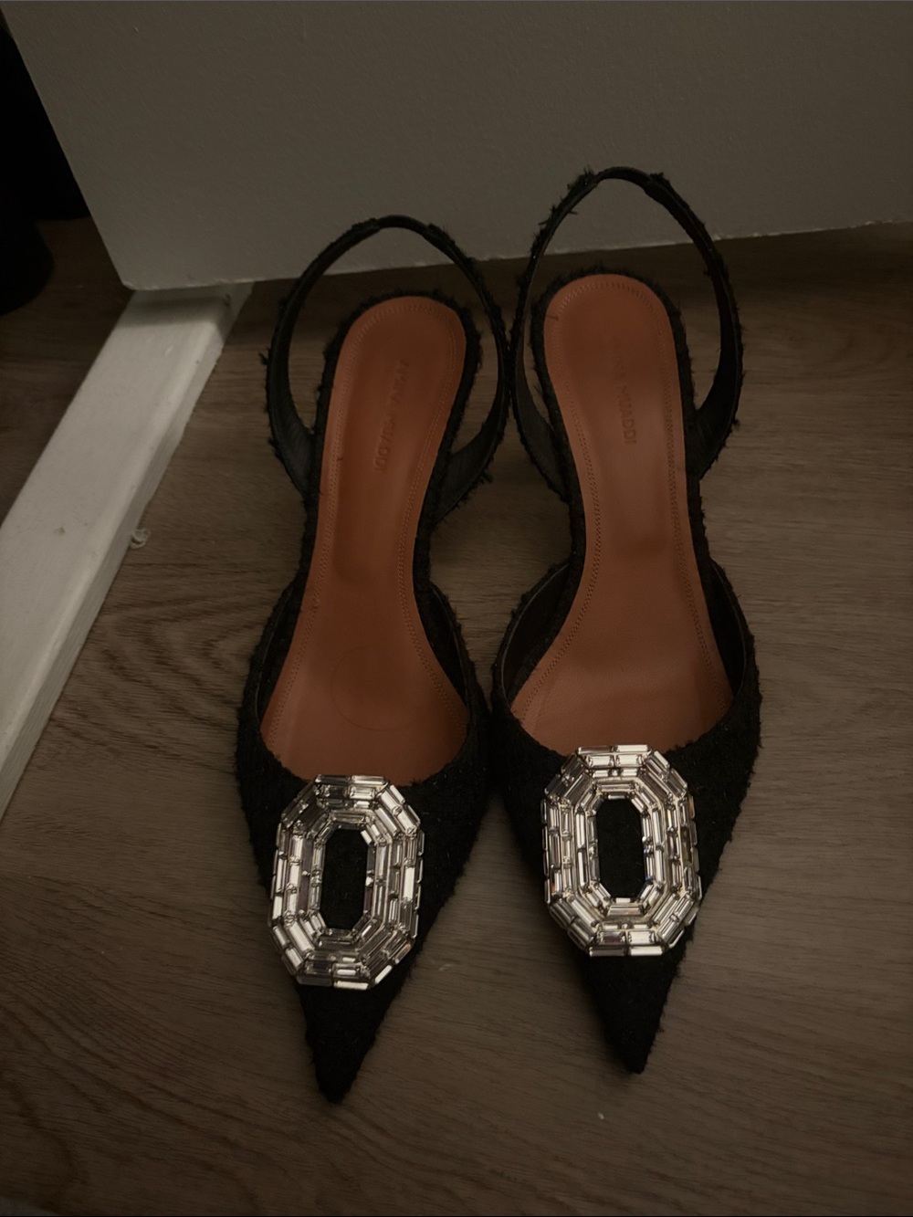 Amina Muaddi low black heel with crystal